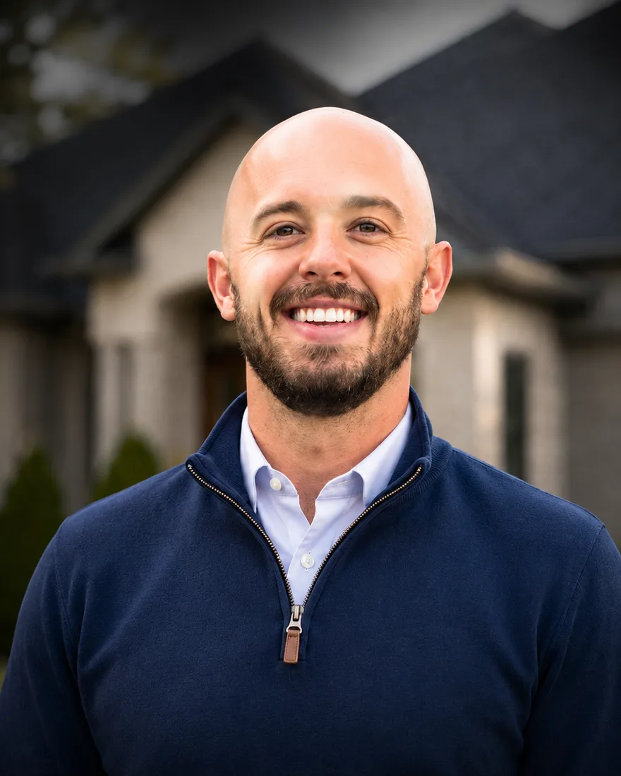 Greg Labbe, owner of Northvale Roofing, in front of a home