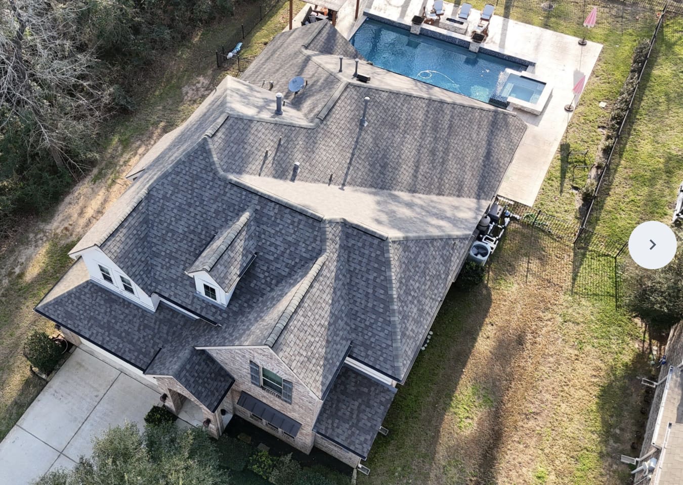 Aerial view of a completed IKO shingle roof replaced by Northvale Roofing on a Humble, TX home
