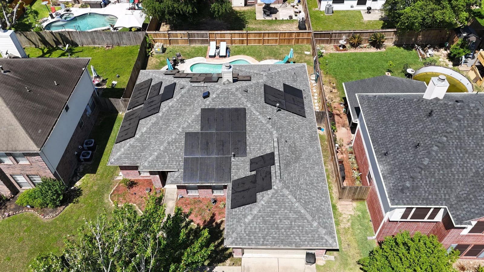Aerial view of a completed IKO shingle roof replaced by Northvale Roofing on a Magnolia, TX home