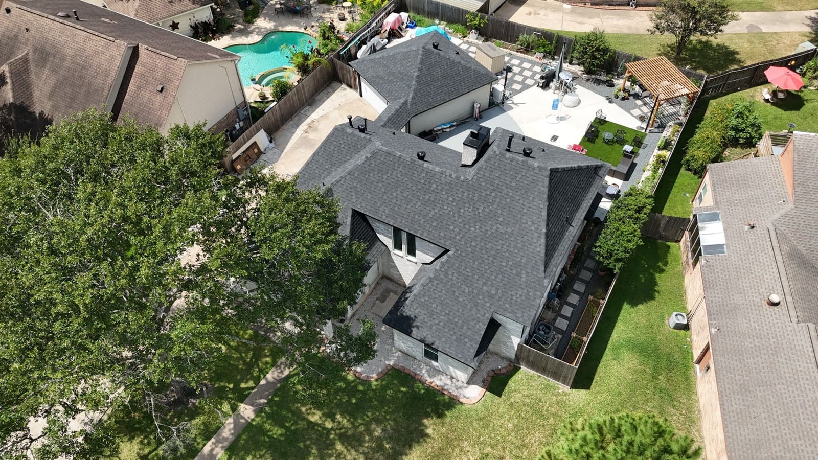 Aerial view of a completed IKO shingle roof replaced by Northvale Roofing on a Spring, TX home