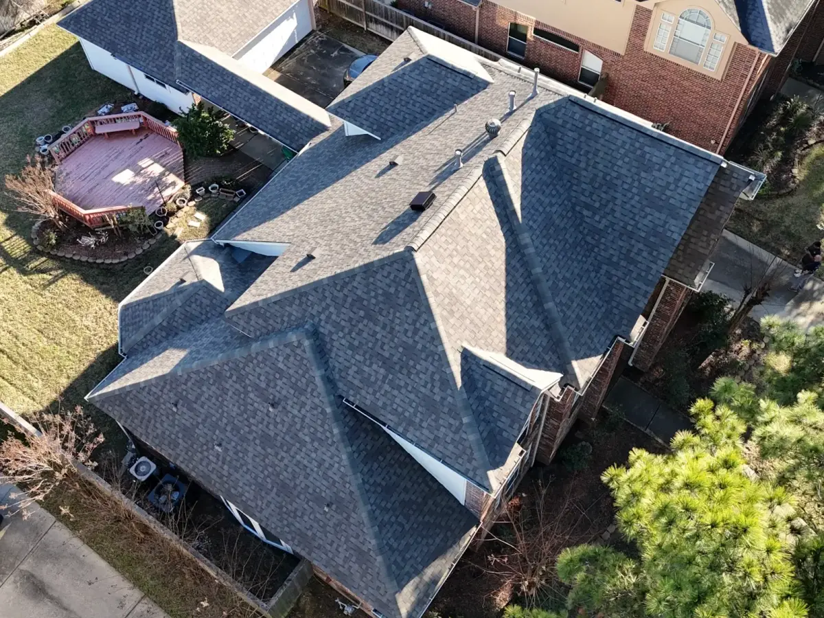 The same roof completed — drone view of the finished shingle roof replacement